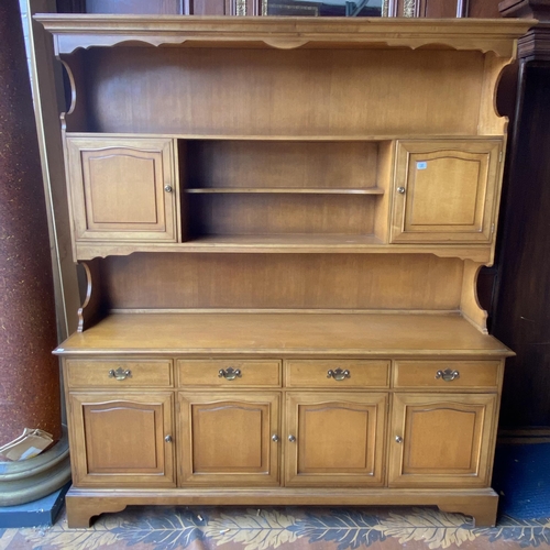 37 - Stag light mahogany dresser with plate rack back on bracket feet