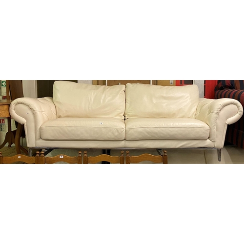 62 - Chesterfield style cream leather three seater settee