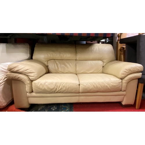 66 - Two seater beige leather settee