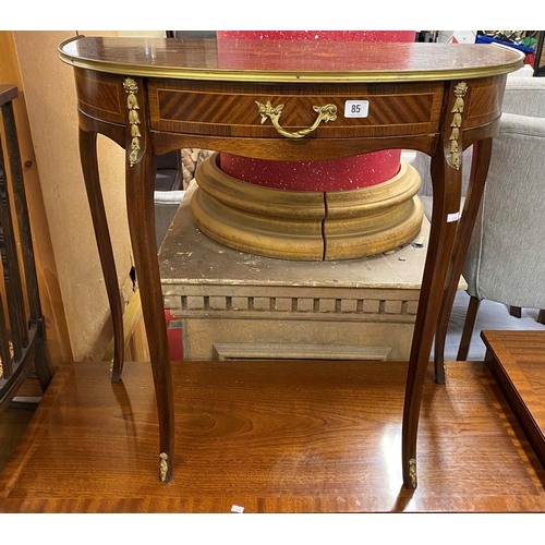 85 - Mahogany inlaid half moon table with ormolu mounts and brass handles