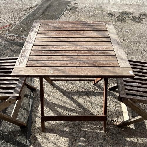 1 - Teak folding garden table and three chairs