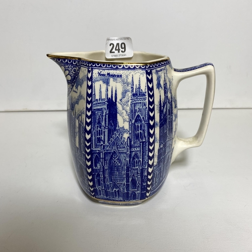 249 - Ringtons milk jug by Wade Ceramics depicting cathedrals and abbeys