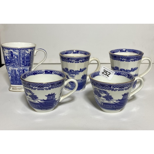 252 - Ringtons teacups and mugs by Wade Ceramics and one Millennium 2000 Ringtons mug