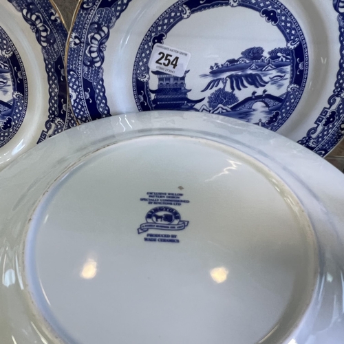 254 - Four Ringtons oriental 10” plates made by Wade Ceramics