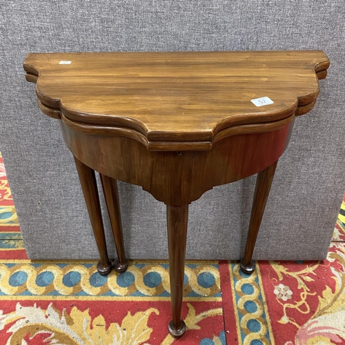 57 - Victorian flip top foot table in mahogany