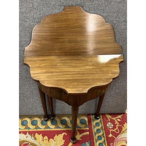 57 - Victorian flip top foot table in mahogany