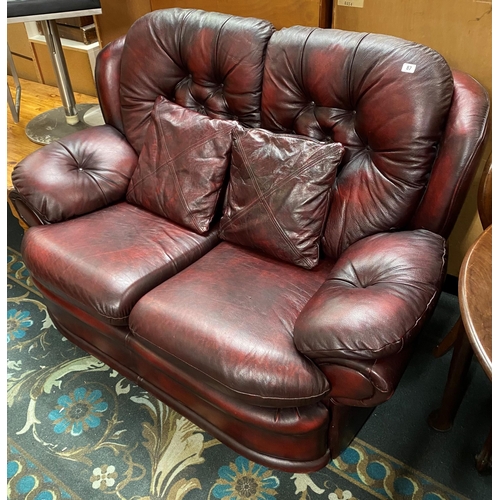 87 - Red leather two seater settee