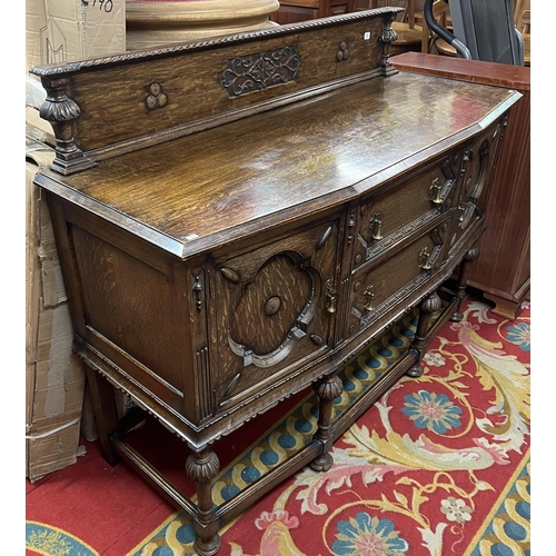 1 - Edwardian oak highly carved sideboard with brass pear drop handles and lovely carved back