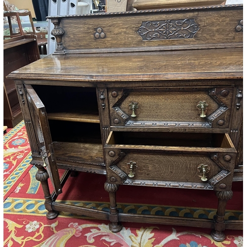 1 - Edwardian oak highly carved sideboard with brass pear drop handles and lovely carved back