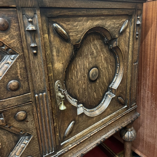 1 - Edwardian oak highly carved sideboard with brass pear drop handles and lovely carved back