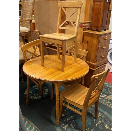 16 - Pine extending dining table with four chairs