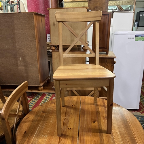 16 - Pine extending dining table with four chairs