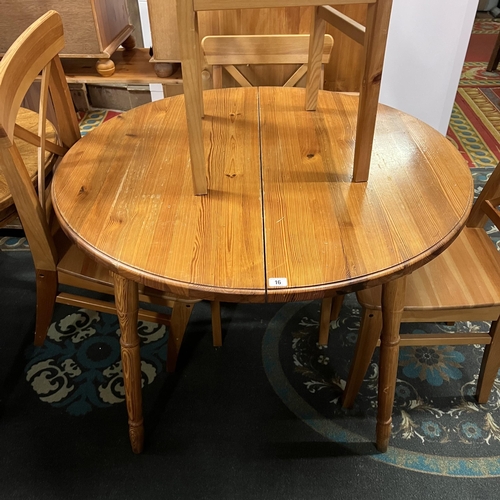 16 - Pine extending dining table with four chairs