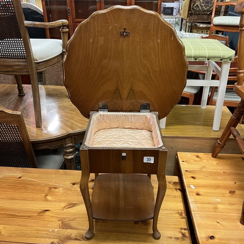 33 - Teak sewing table on Queen Anne legs