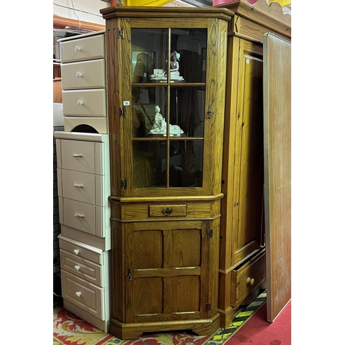 56 - Oak drawer front corner cabinet