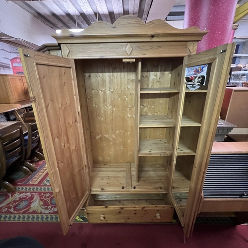 57 - Pine double door wardrobe on drawer base