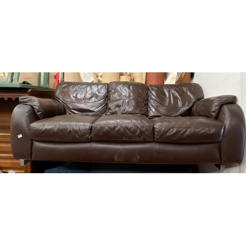 77 - Brown leather three seater settee