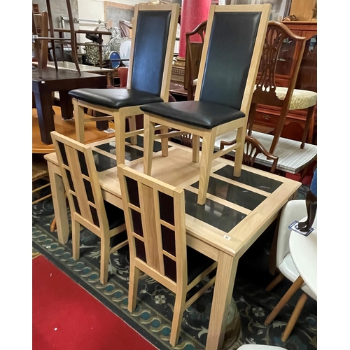 41 - Bleached oak dining table with granite inserts and four matching chairs