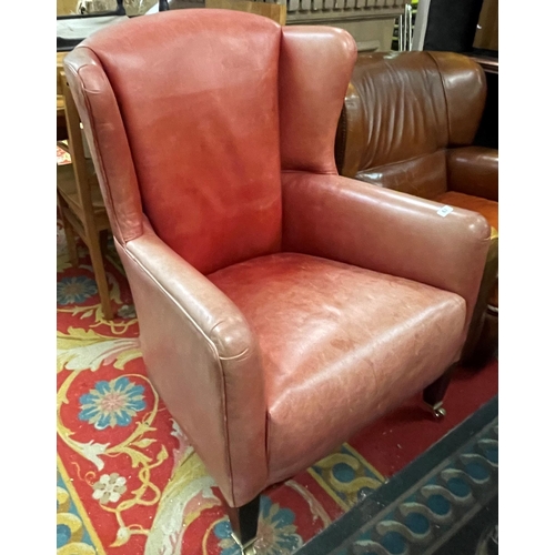 67 - Barker and stonehouse leather armchair on brass castors