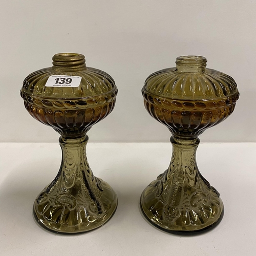 139 - Pair of moulded glass oil lamp fonts