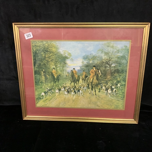 323 - Gilt framed print depicting hunters