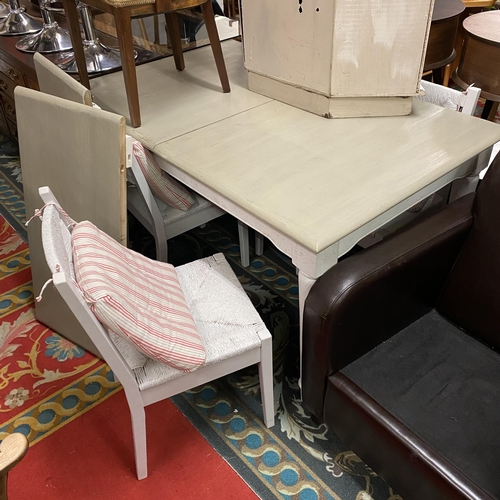 55 - Large painted kitchen table with four rush bottom seated chairs