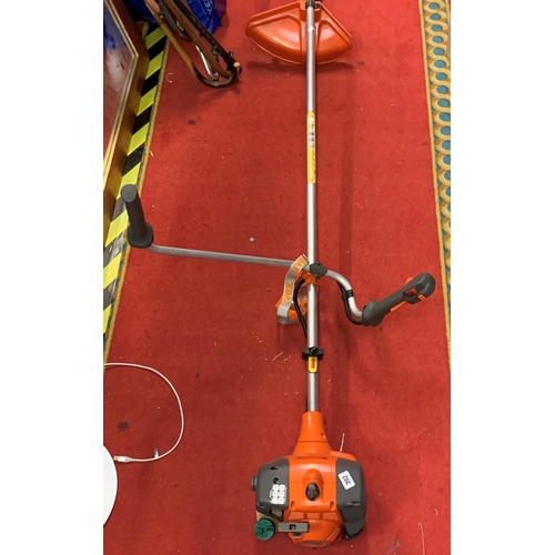 392 - Husqvarna petrol strimmer with goggles and back support