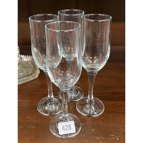 428 - Four heavy Champagne Glasses