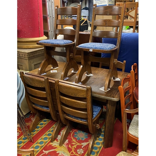 85 - Solid oak extending dining table with six matching chairs