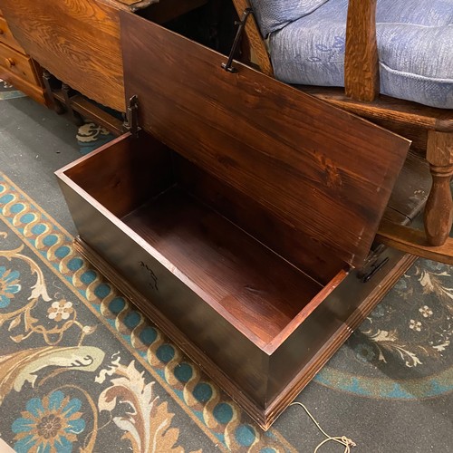 66 - Stained pine large storage coffee table with exposed iron work hinges and catches