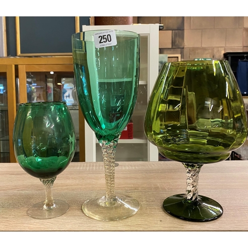 250 - THREE LARGE COLOURED GLASS TWISTED STEM GLASSES