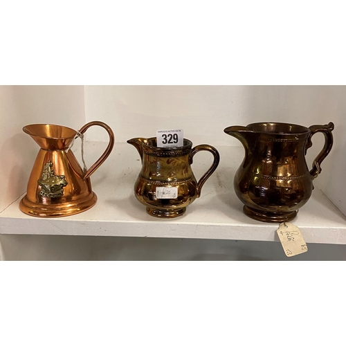 329 - TWO COPPER LUSTRE JUGS AND A COPPER JUG