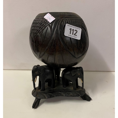 112 - CARVED COCONUT SUPPORTED ON THREE EBONY ELEPHANTS C1900