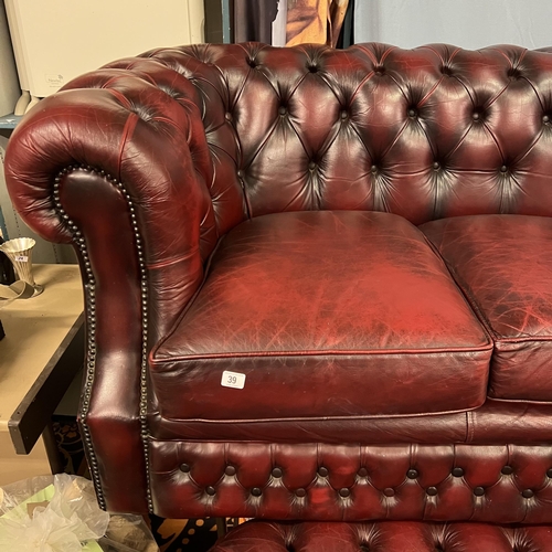 39 - THREE SEATER OXBLOOD CHESTERFIELD SETTEE WITH MATCHING ARMCHAIR