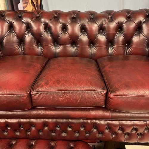 39 - THREE SEATER OXBLOOD CHESTERFIELD SETTEE WITH MATCHING ARMCHAIR