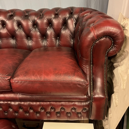 39 - THREE SEATER OXBLOOD CHESTERFIELD SETTEE WITH MATCHING ARMCHAIR