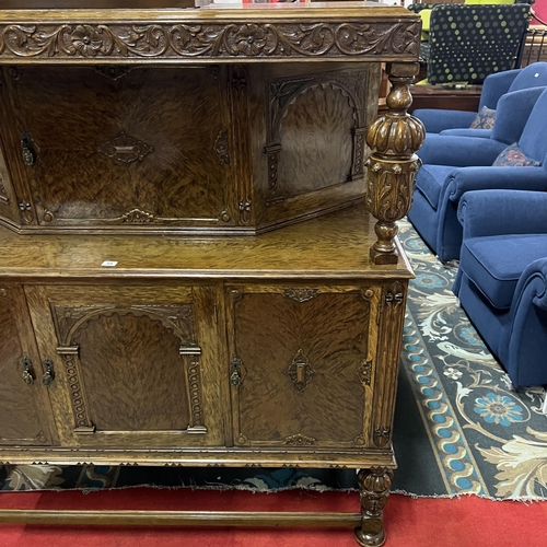 54 - BURR WALNUT HEAVILY CARVED BUFFET SIDEBOARD WITH TUDOR STYLE CARVED COLUMNS AND LEGS