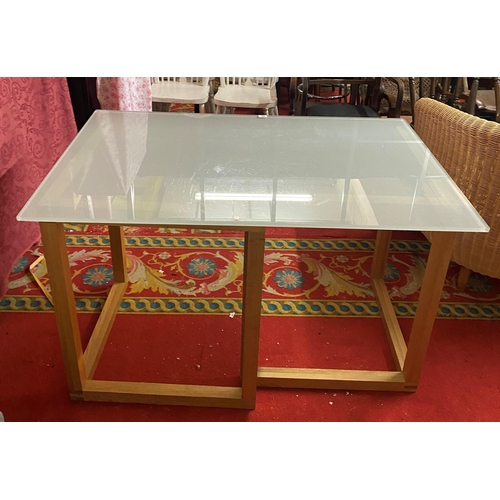 25 - OPAQUE GLASS TOPPED DESK WITH GOLDEN OAK TRESTLES BY NEXT