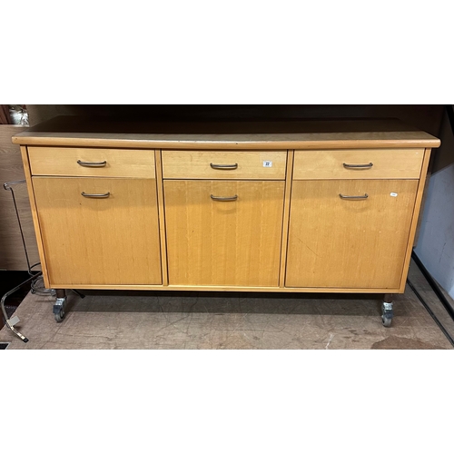 22 - THREE DRAWER, THREE CUPBOARD SIDEBOARD IN BEECH.