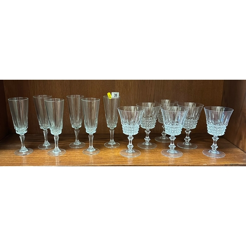 39 - A SET OF 6 GLASS FLUTES AND 6 WINE GLASSES