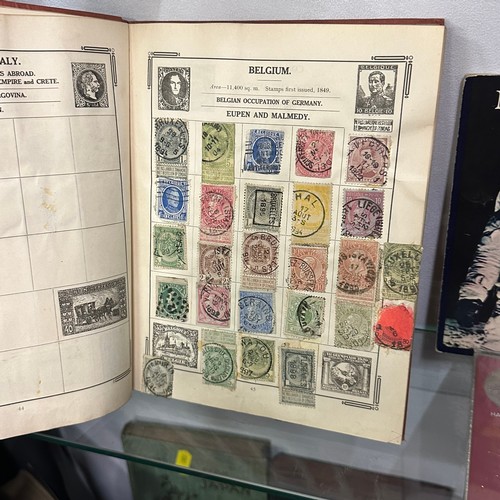 154 - ATLAS STAMPS ALBUM CONTAINING VARIOUS STAMPS