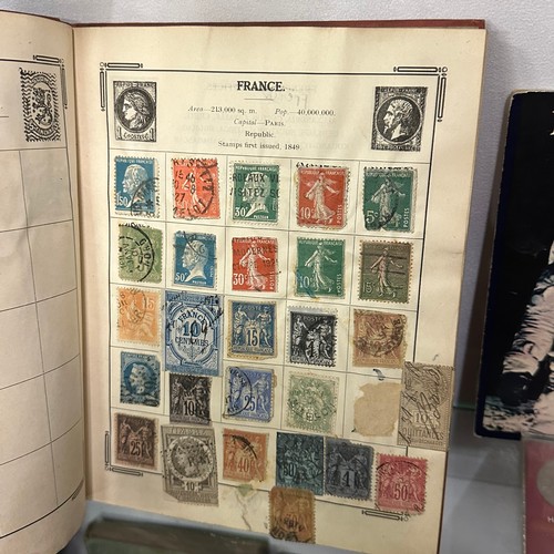 154 - ATLAS STAMPS ALBUM CONTAINING VARIOUS STAMPS