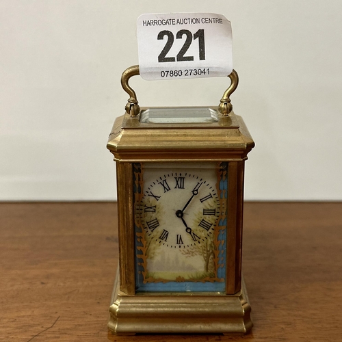 221 - HANDS BRASS AND PORCELAIN HAND PAINTED MINIATURE CARRIAGE CLOCK