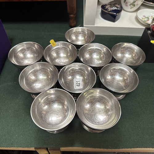 421 - TEN STAINLESS STEEL DISHES