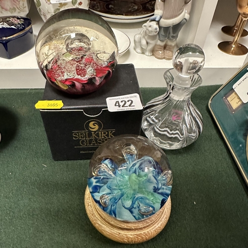 422 - TWO SELKIRK PAPERWEIGHTS AND A CAITHNESS PERFUME BOTTLE