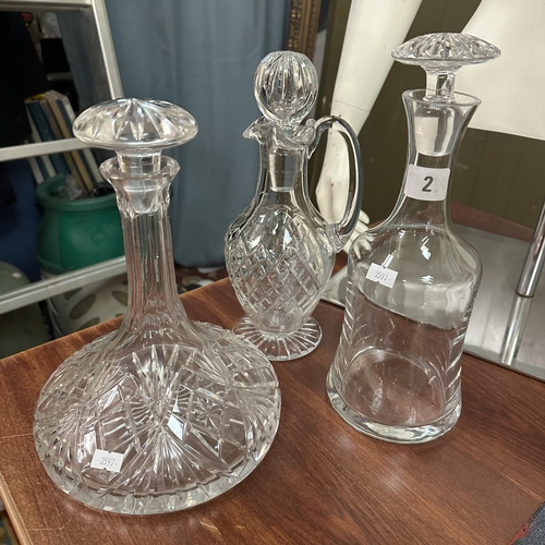 2 - TWO CRYSTAL DECANTERS AND A CLARET JUG