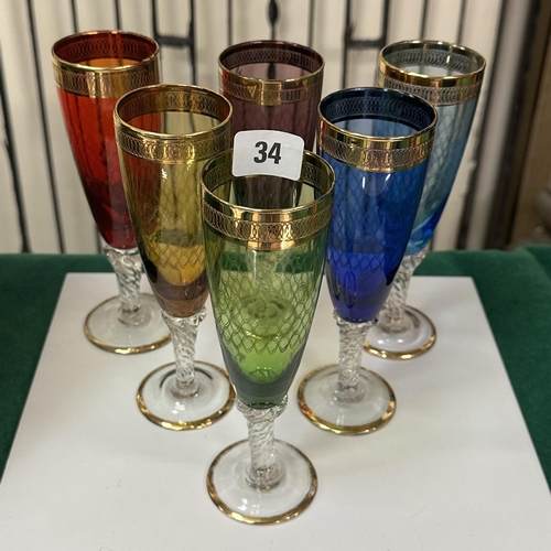 34 - SIX COLOURED CHAMPAGNE FLUTES