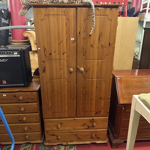 20 - PINE DOUBLE DRAWER WARDROBE WITH TWO DRAWER BASE