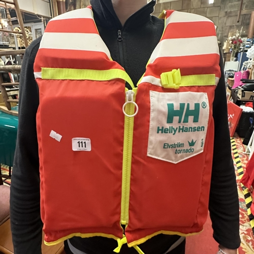 111 - HELLY HANSEN LIFE JACKET IN AS NEW CONDITION