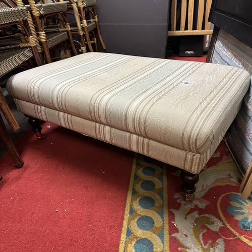 176 - LARGE FOOTSTOOL ON TURN LEGS AND BRASS CASTORS